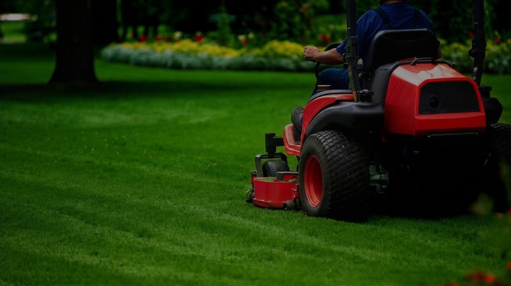 Cypress Landscaping crew mowing a manicured Halifax lawn