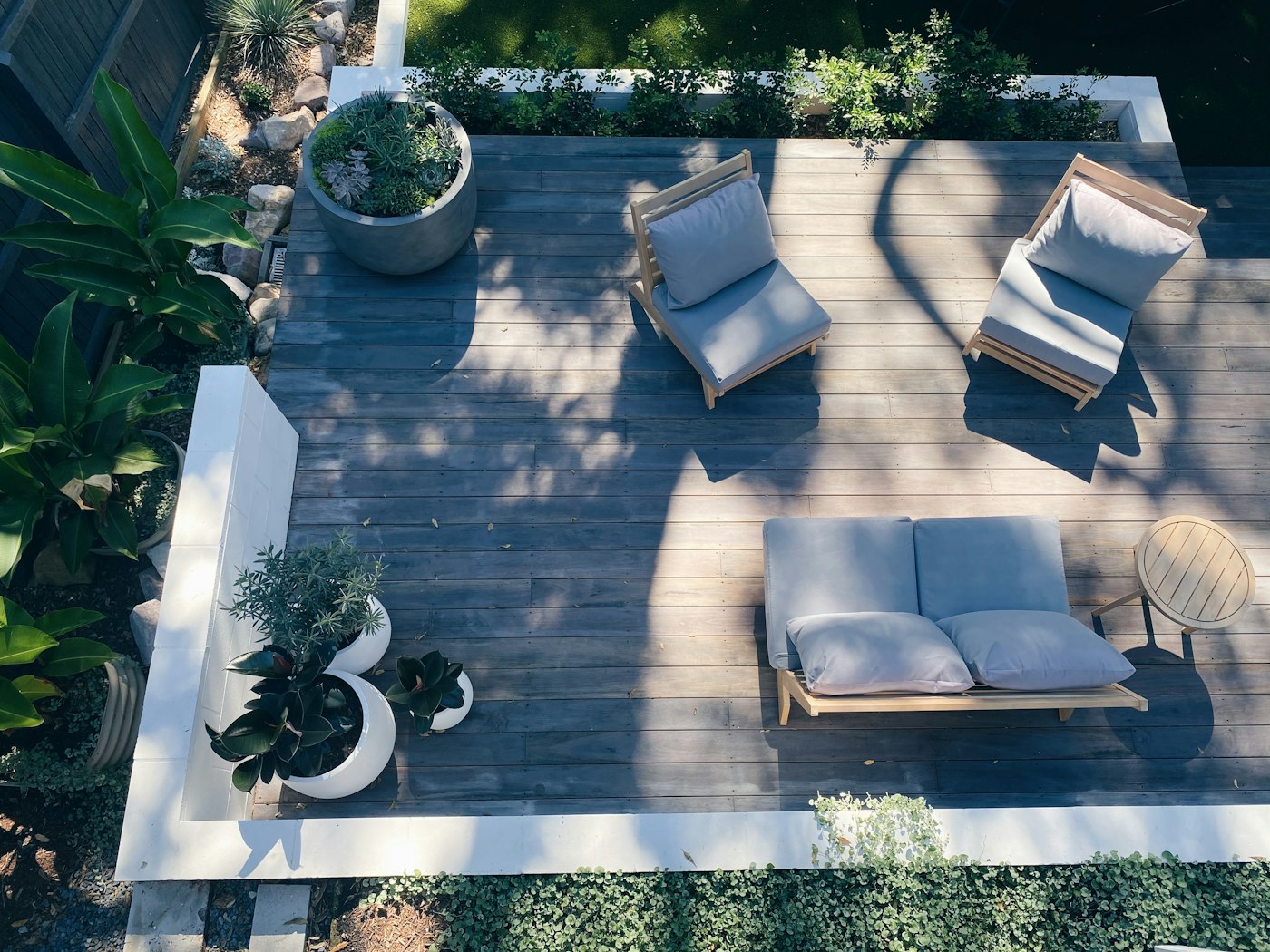 A landscaped backyard patio and deck